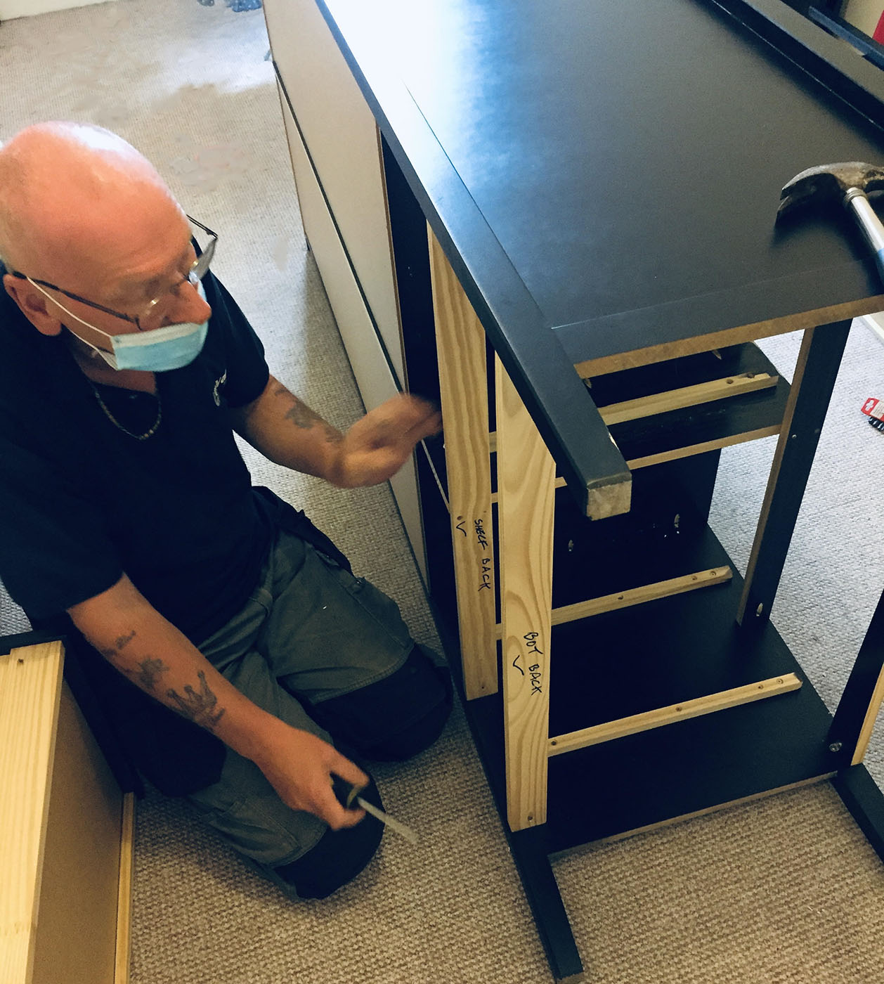 Furniture Dismantling & Reassembly this image shows one of our handy men dismantling a wardrobe