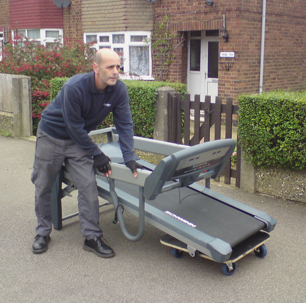 Removals this picture shows one of our movers using a professional skatebaord to move a large running machine